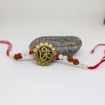 Om Rakhi With Rudraksh and Pearls
